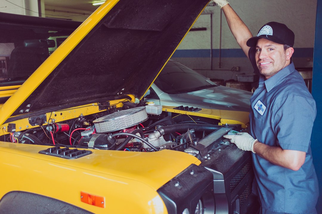 Experienced automotive technician working on a premium luxury vehicle during service